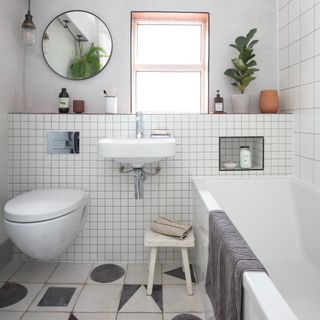 White-tiled bathroom with contrasting grout