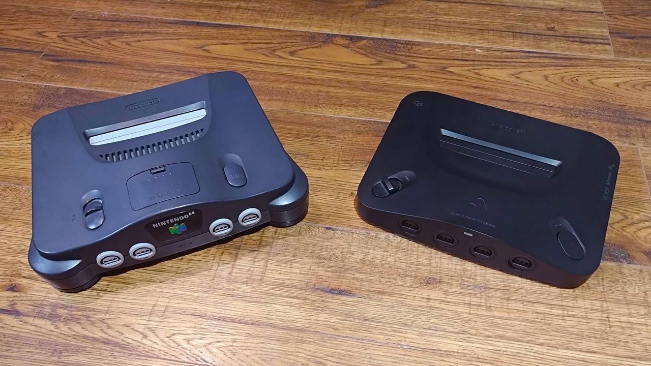 Analogue 3D on right and N64 on left on woodgrain surface.