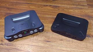 Analogue 3D on right and N64 on left on woodgrain surface.