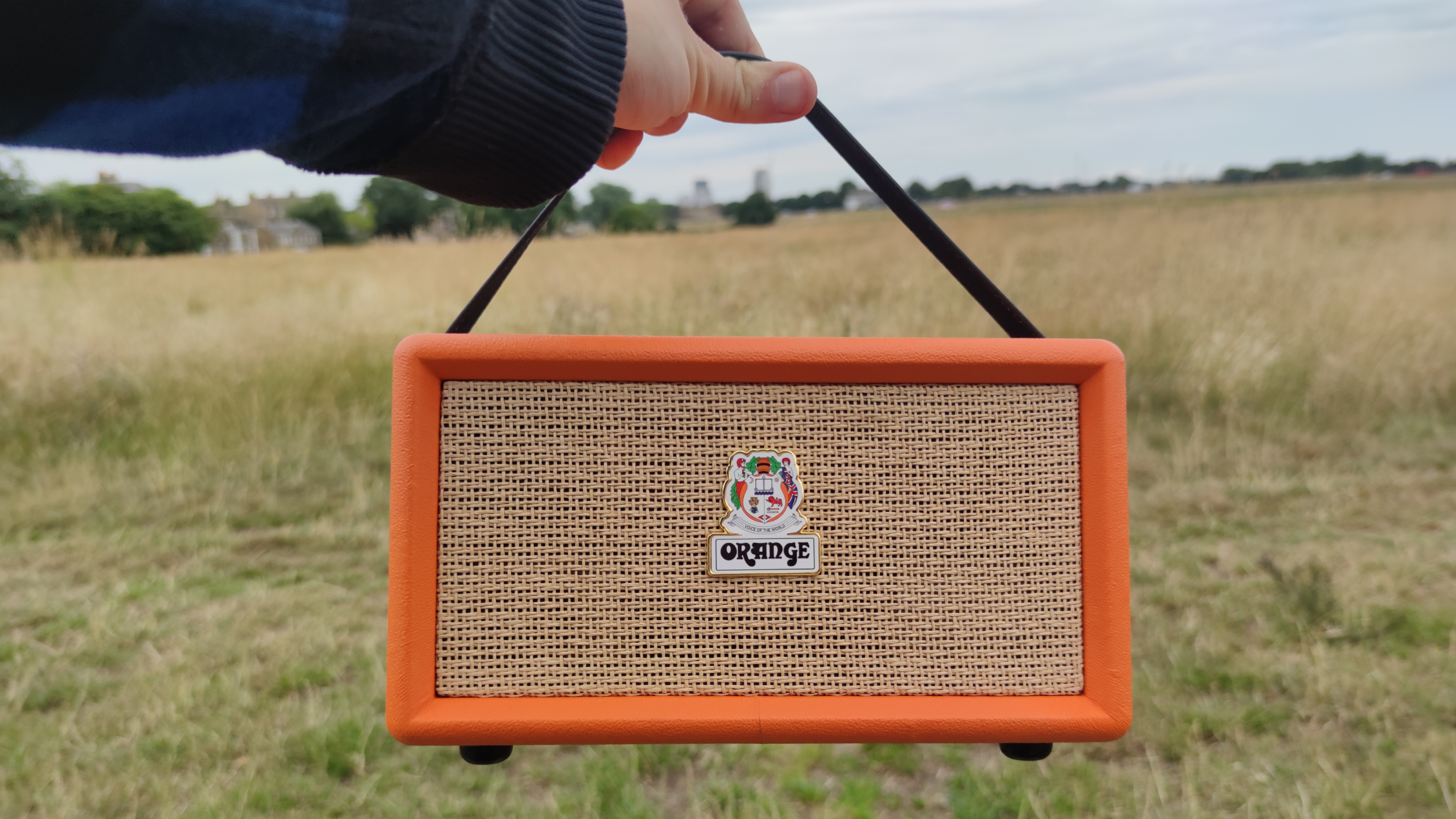 The Orange Box suspended by its carry strap