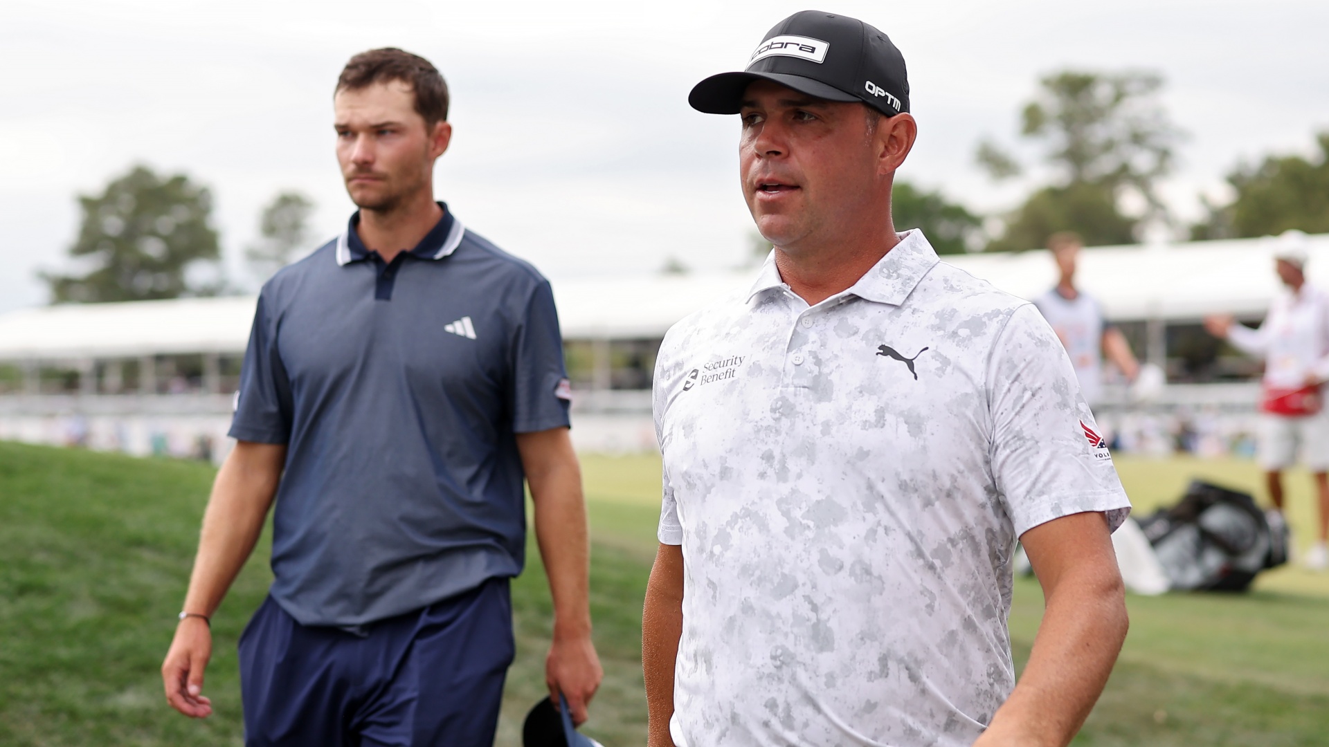 Nicolai H&oslash;jgaard and Gary Woodland walk off the 18th green after the third round of the 2026 Houston Open