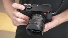 Leica Q3 camera in the hand