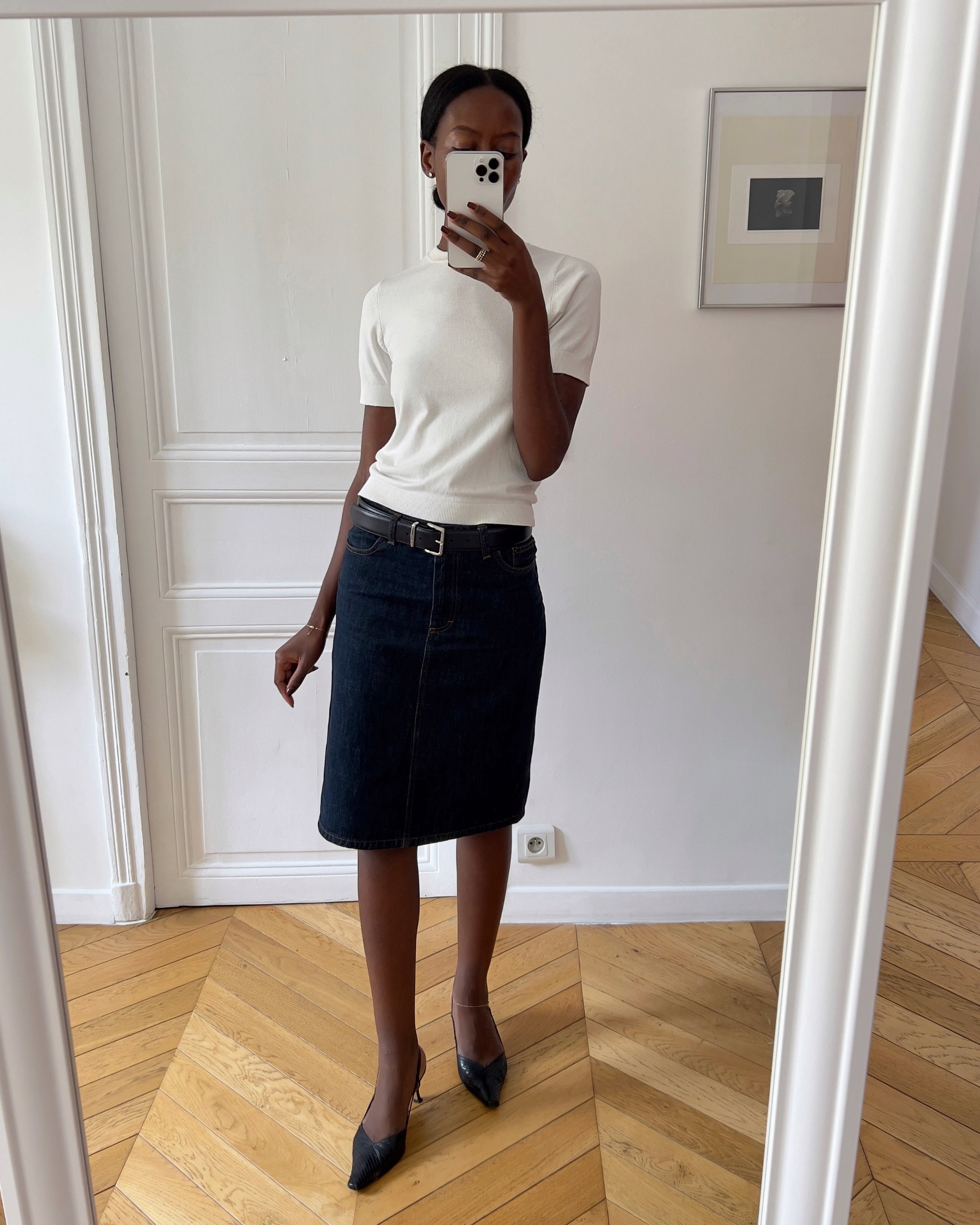 Influencer Sylvie Mus wearing a short sleeve jumper, midi skirt and slingback heels.