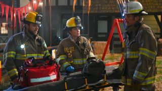 From left to right: Bode, Gabriela and Vince all standing around a gurney in Fire Country.