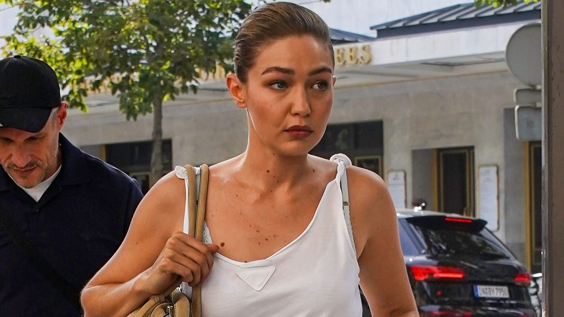 Gigi Hadid wore a white tank top from Prada with culottes and the Mary Janes shoe trend