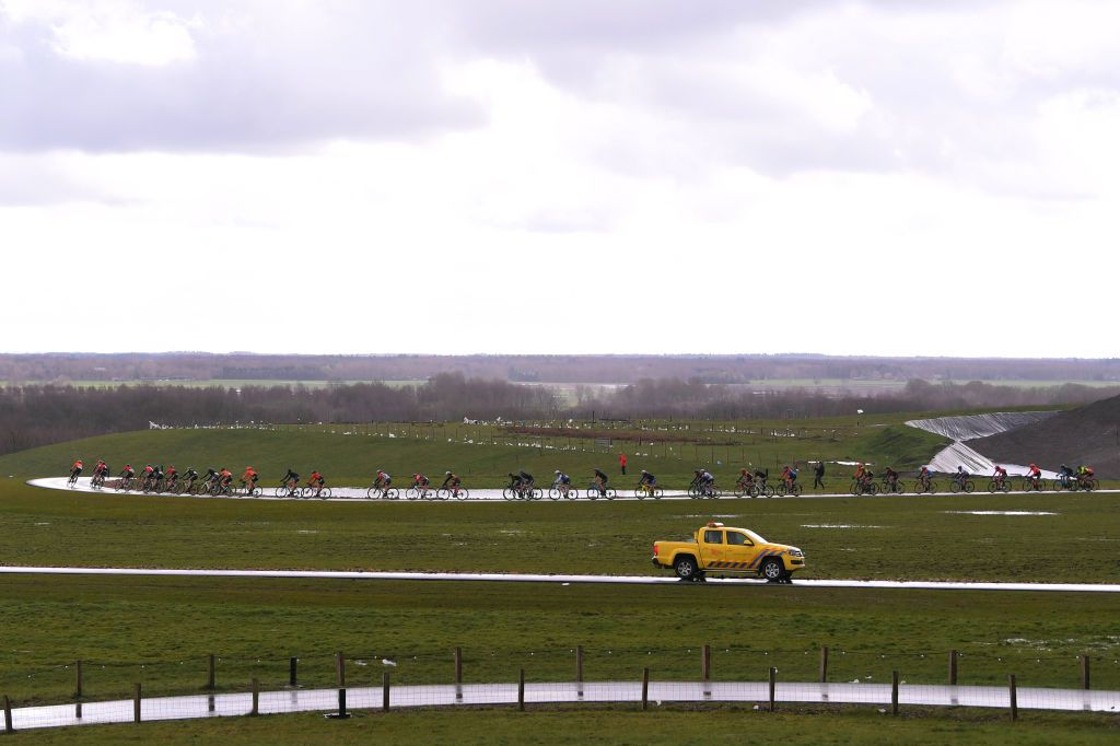 The riders wind their way down the road