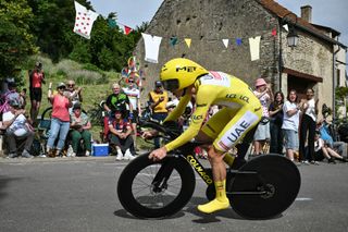 Tadej Pogačar speeds along in the yellow jersey en route to second at the Tour de France stage 7 time trial