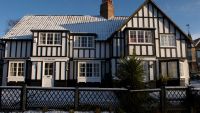 A Tudor house with snow on it