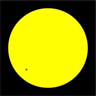 Black background, yellow circle and red dot