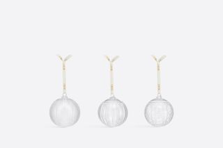 Three clear glass Christmas baubles by Dior