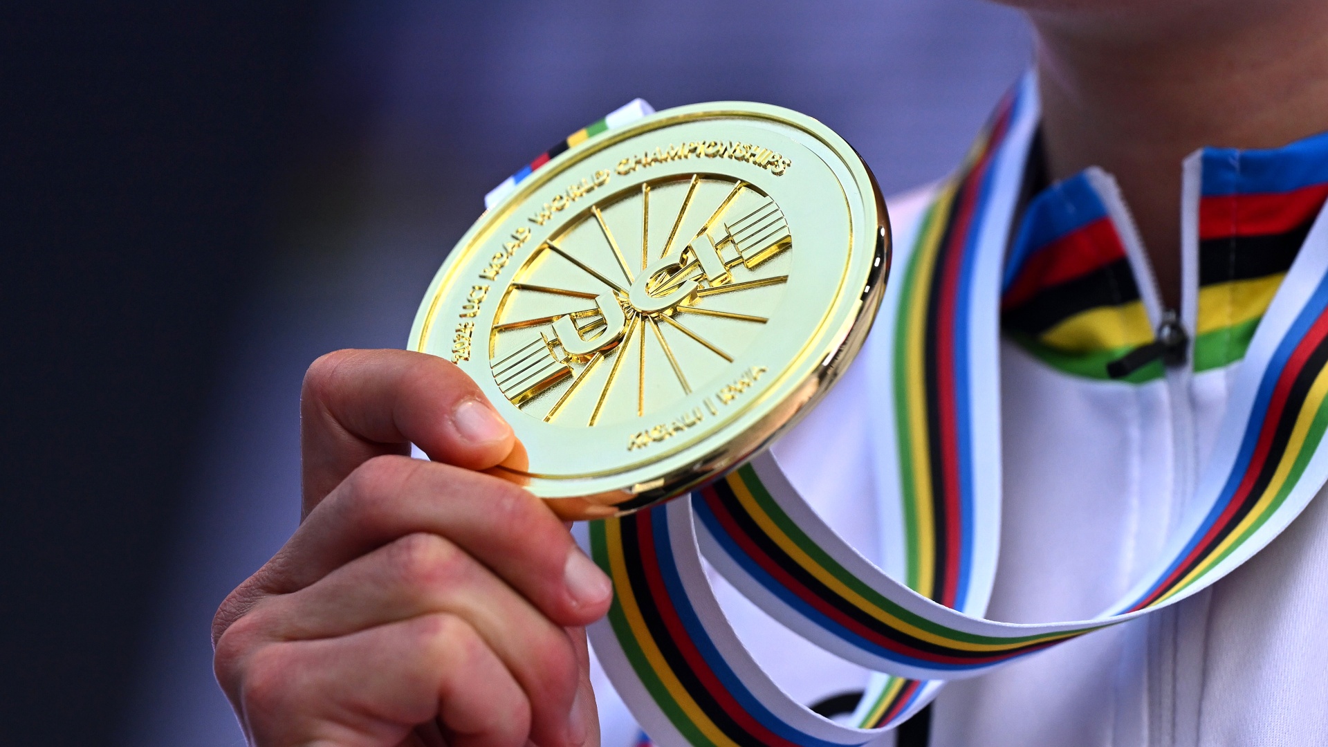 A close-up of Magdeleine Vallieres' Road World Championships gold medal and rainbow jersey in 2025