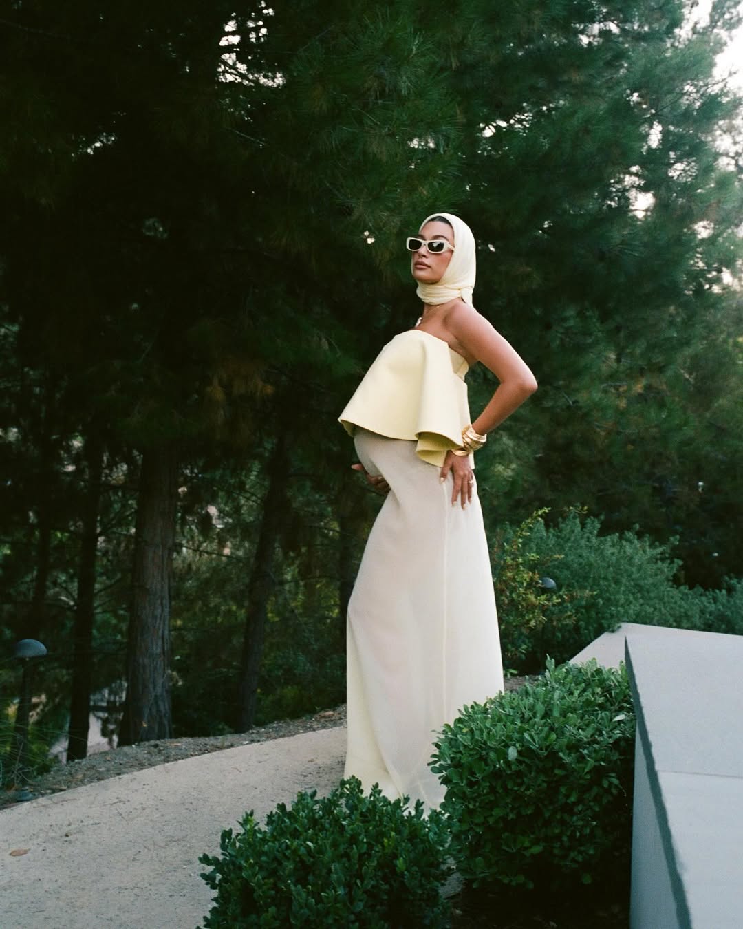 Hailey Bieber wears a Jacquemus butter yellow dress at her baby shower