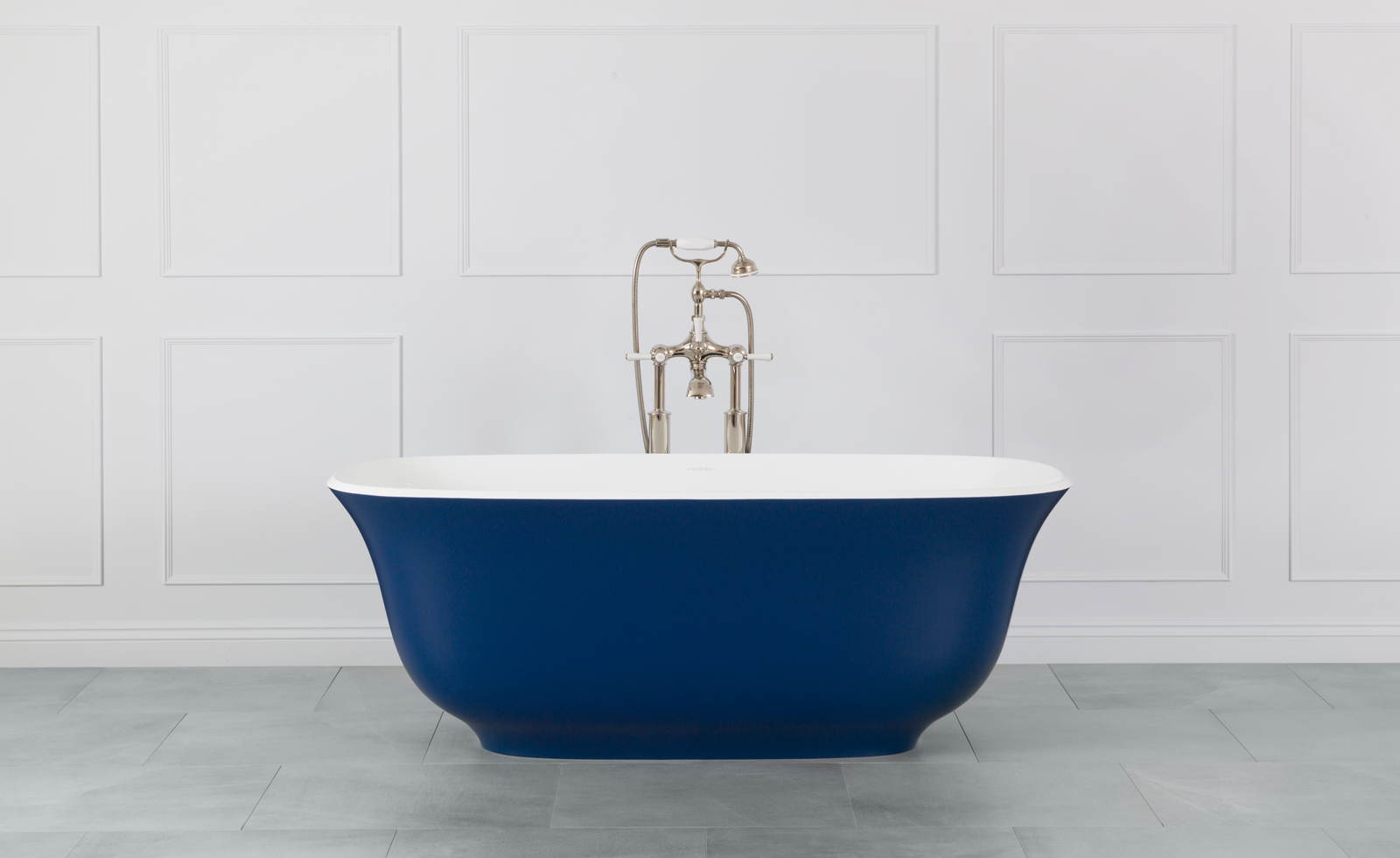 Blue 'Amiata' volcanic limestone bathtub by Victoria and Albert in white bathroom