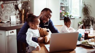 man working from home with kids