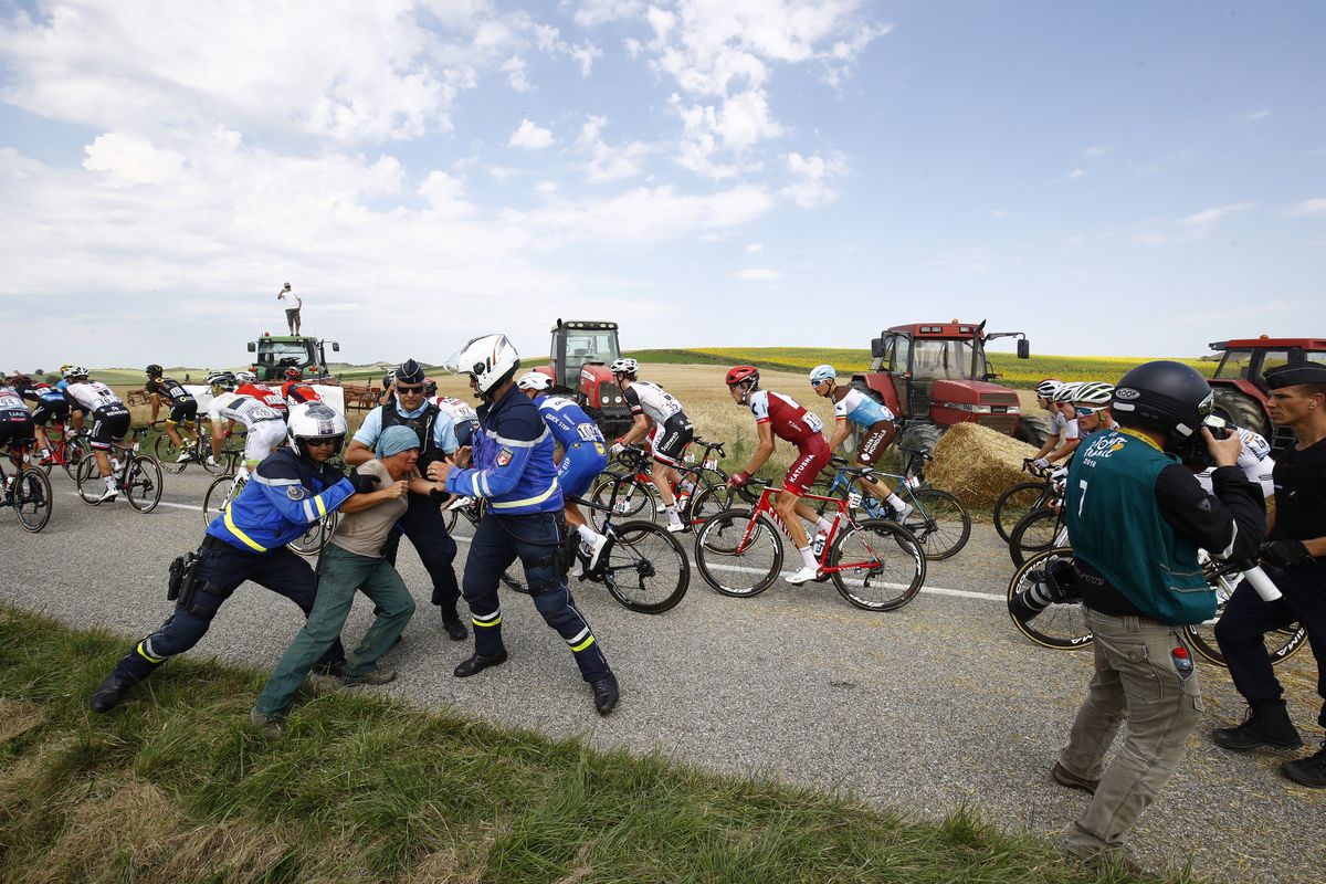 Police subdue a protest that disrupted the Tour de France