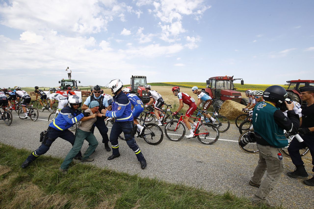Police subdue a protest that disrupted the Tour de France