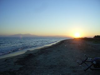 The sun sets over the Greek peninsula of Kassandra, where scientists conducted fieldwork. Mount Olympus looms in the distance.
