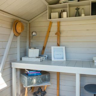 home office with wooden desk and silver trunk