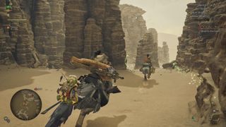 Monster Hunter Wilds review; A video game scene depicts multiple figures on horseback in a rocky desert canyon.