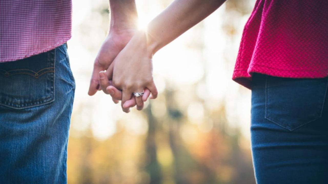 A married couple holding hands on Valentine&#039;s Day.