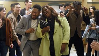 Aaron Jennings as Anthony and Nicole Byer as Nicky laughing and hugging in Grand Crew season 2 finale