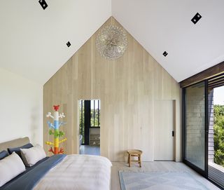 timber clad feature wall in bedroom