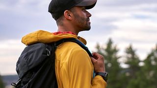 Man hiking wearing Garmin Epix (Gen 2) watch