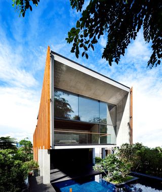 Back of building with huge windows & outdoor pool