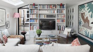 Living room showing TV inset into a bookcase