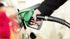 Close-up of a person refuelling their car at a gas pump