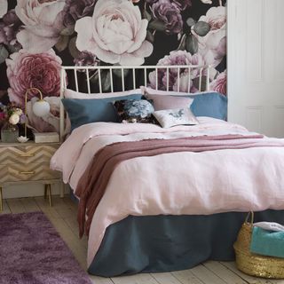 Pink and grey bedroom with flower mural