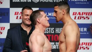 Paul Gallen and Justis Huni face each other during the official weigh-in