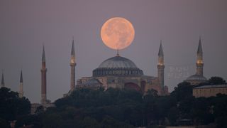 A supermoon rises over the Hagia Sophia in Turkey