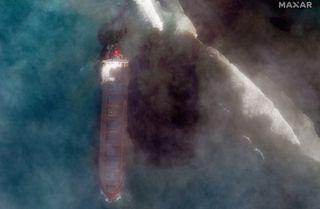 A bulk carrier ship, MV Wakashio, that recently ran aground off the southeast coast of Mauritius has been spilling oil into the sea, as seen in satellite images captured by Maxar Technologies on Aug. 7, 2020.