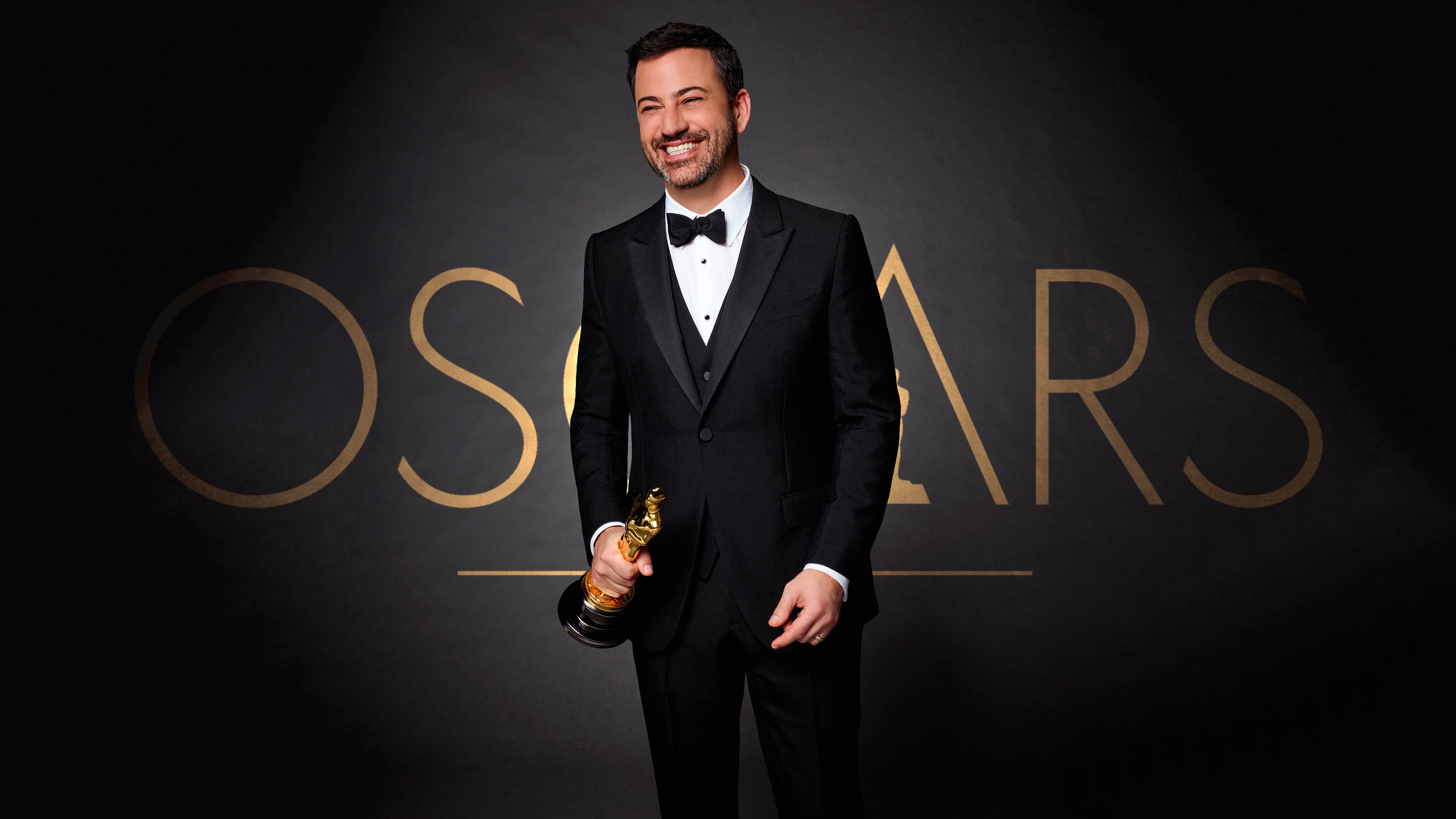 Jimmy Kimmel holding an Oscar statue