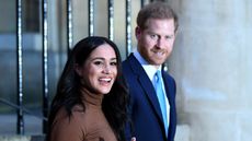 Prince Harry, Duke of Sussex wears suit and Meghan, Duchess of Sussex wears brown turtle neck jumper after their visit to Canada House