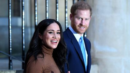 Prince Harry, Duke of Sussex wears suit and Meghan, Duchess of Sussex wears brown turtle neck jumper after their visit to Canada House