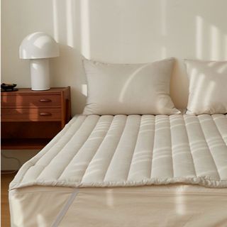 Whipped Cream Tencel Modal Bedsheet on a bed.