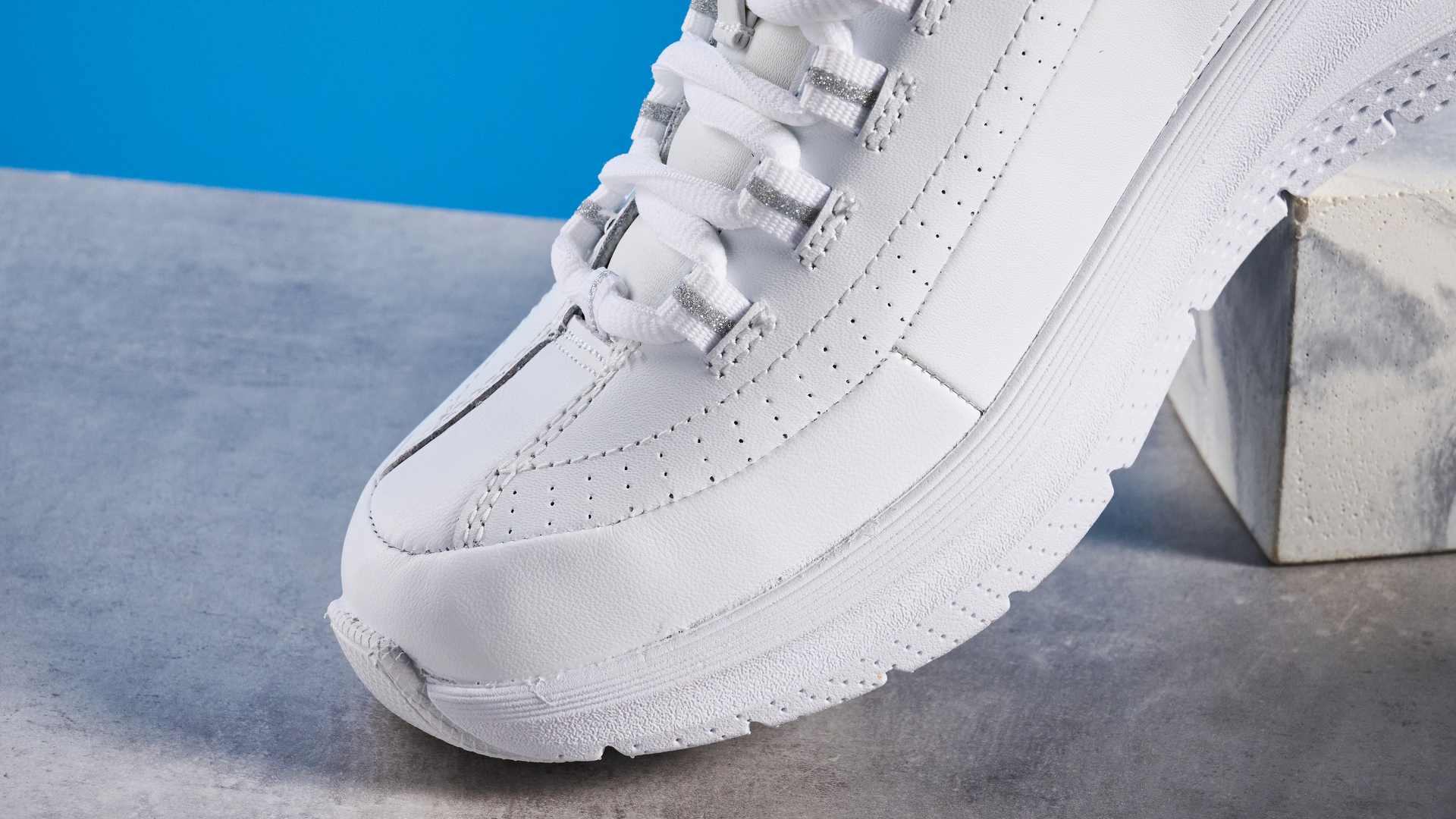 Skechers Arch Fit 2.0 Star Bound photographed in front of a blue background.