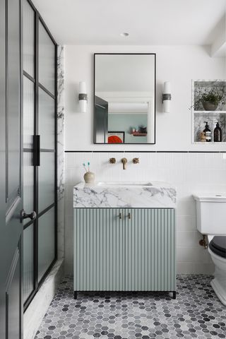 modern bathroom with blue vanity unit