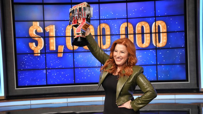 Lisa Ann Walter shows off her trophy after winning $1 million for charity on Celebrity Jeopardy!