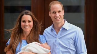 Prince William and Catherine, Princess of Wales with their son Prince George standing on the steps outside the Lindo Wing of St Mary's Hospital in London on July 23, 2013