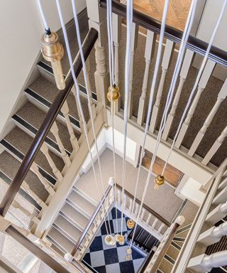 Staircase lighting idea by Design by Urban Matrix using Edison-style lightbulbs