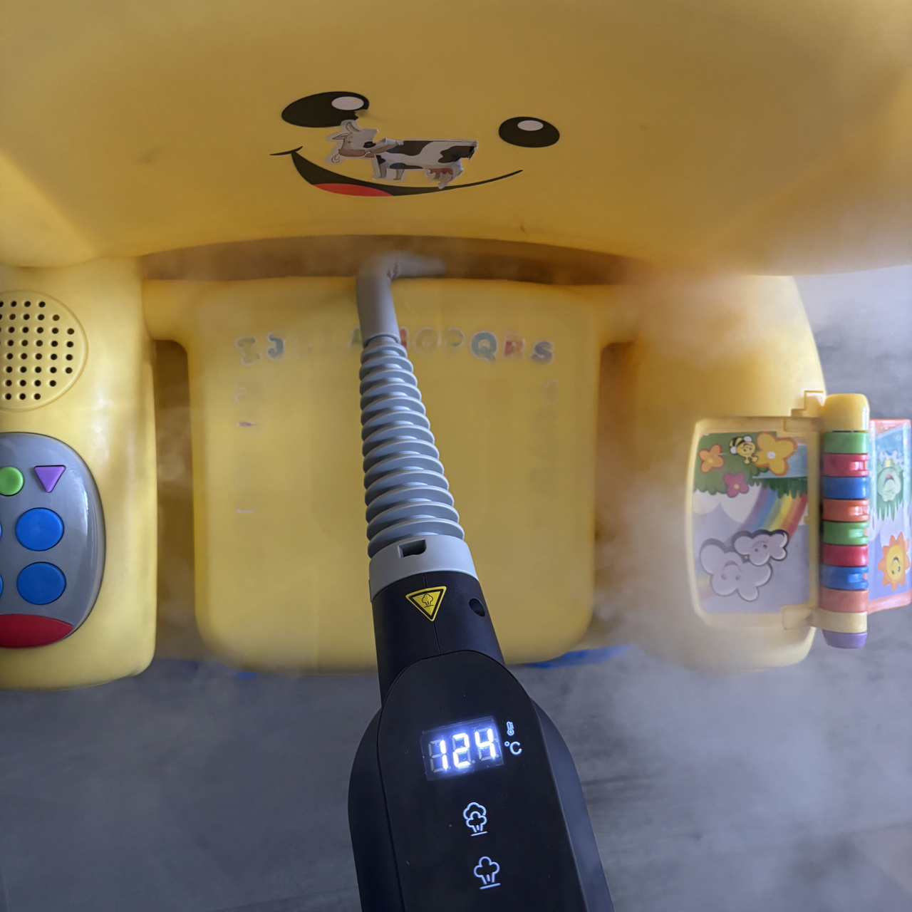 Beldray Digital Handheld Steam Cleaner cleaning yellow plastic kids chair