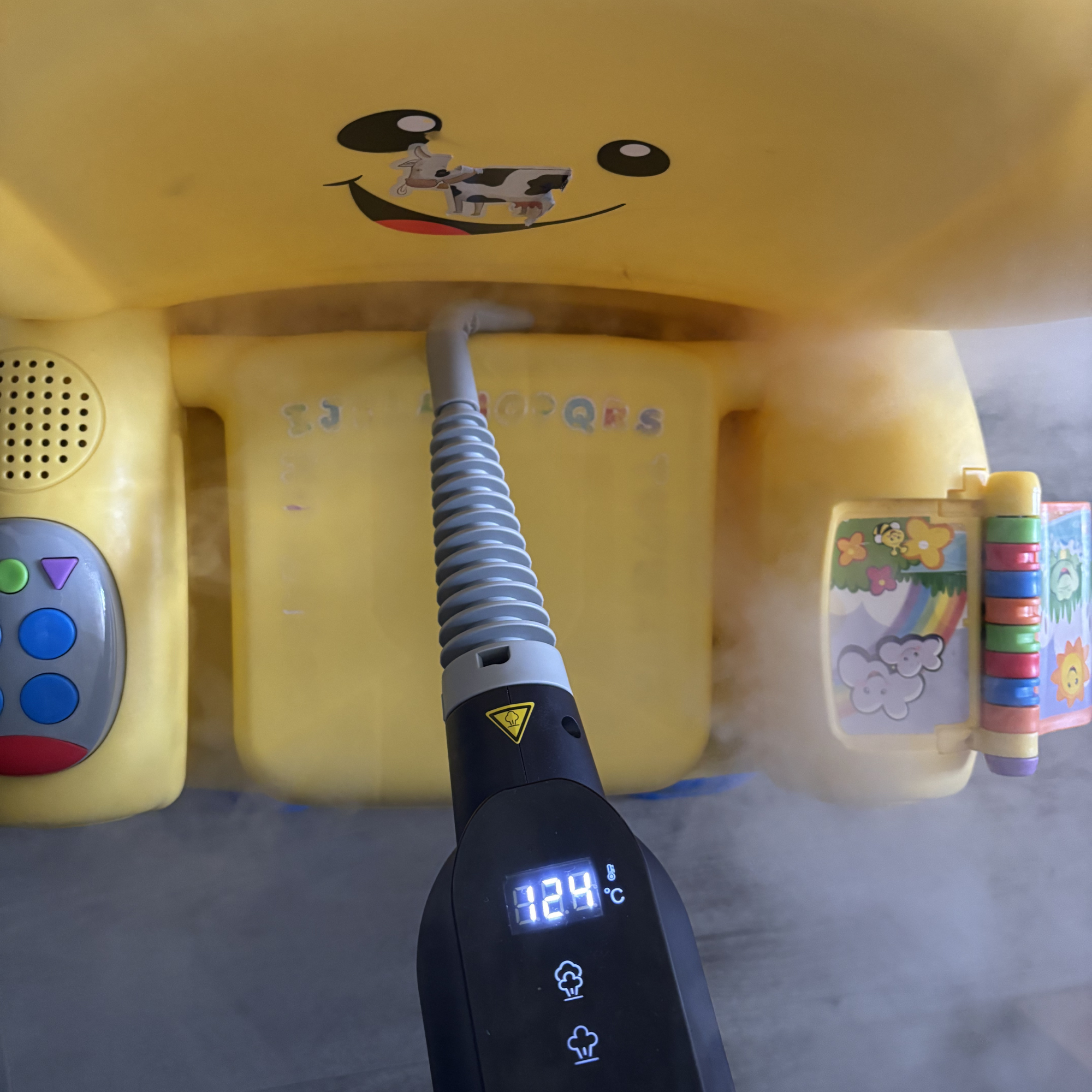 Beldray Digital Handheld Steam Cleaner cleaning yellow plastic kids chair 
