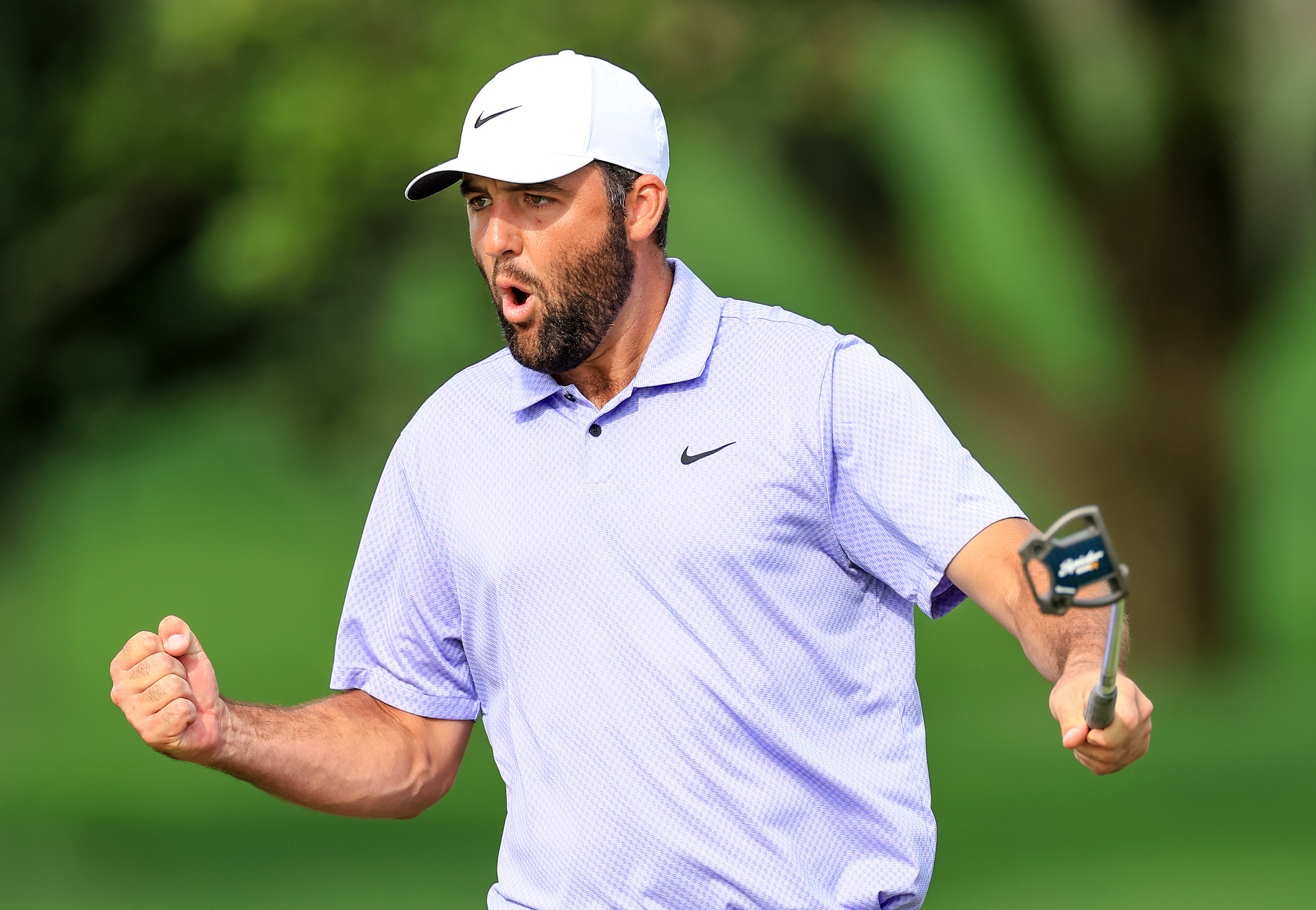 Scottie Scheffler celebrates a putt