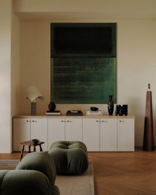 A calm living room with green tones