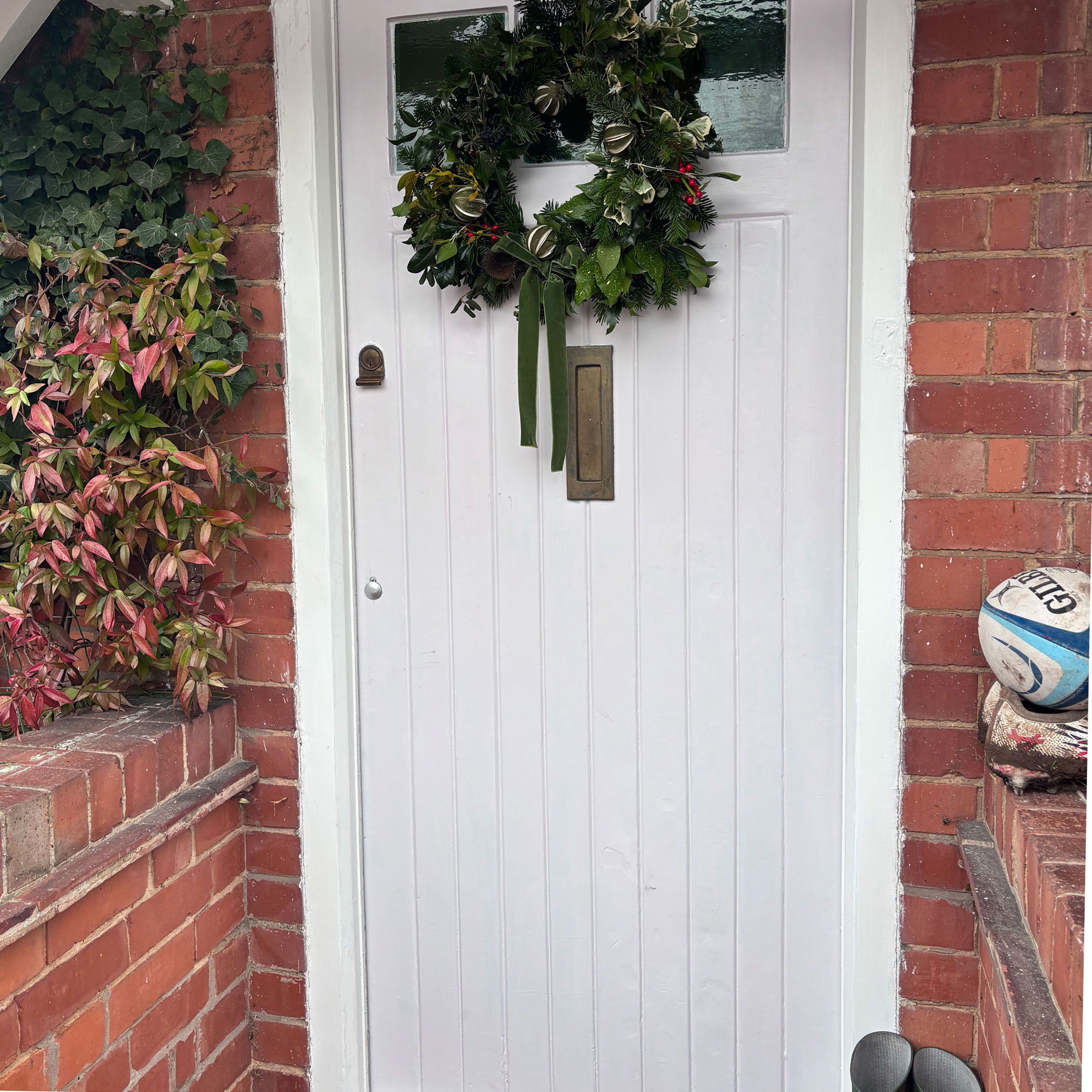 pale pink Edwardian front door with Christmas wreath