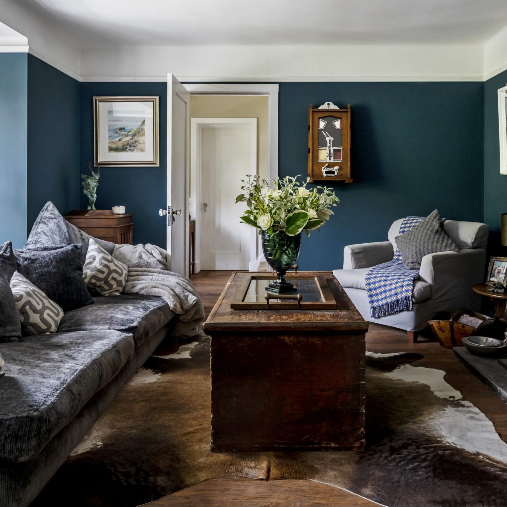 blue wall with sofa & chair