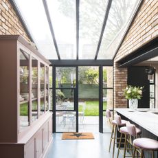 Glazed roof leading down to Crittal doors in a kitchen diner